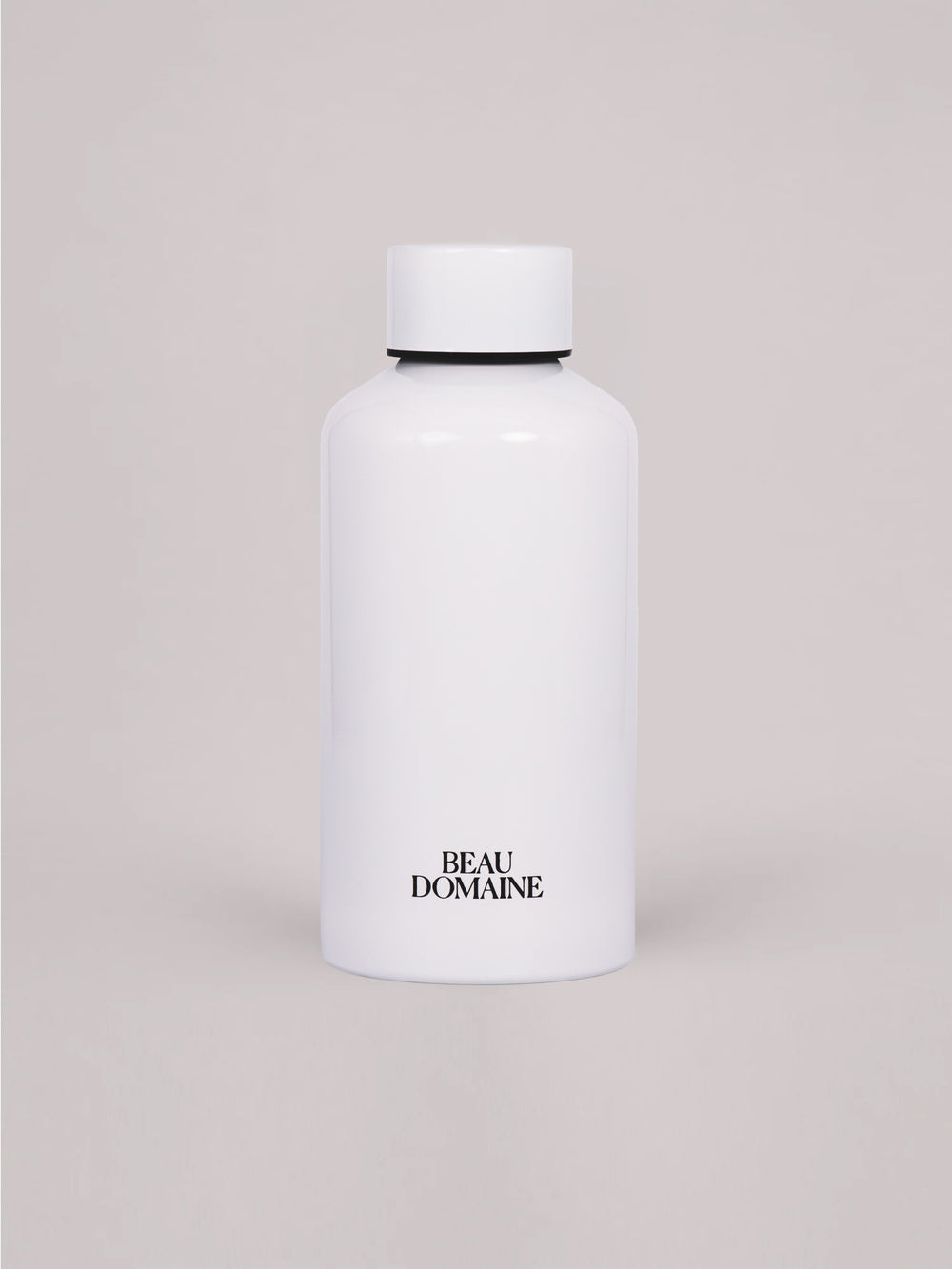 White bottle with 'Beau Domaine' branding on a beige background